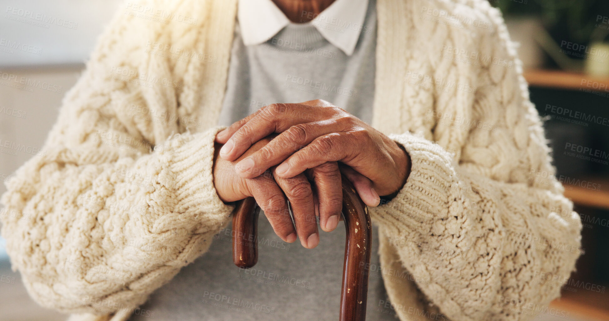 Buy stock photo Cane, hands and senior person in home living room for assistance, balance or retirement. Healthcare, walking stick or wellness and old man with disability in apartment for break, relax or weekend