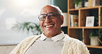 Glasses, portrait and smile with old man in retirement home for break, optimism or satisfaction. Relax, unwind and wellness with happy senior person in living room of apartment for weekend chill