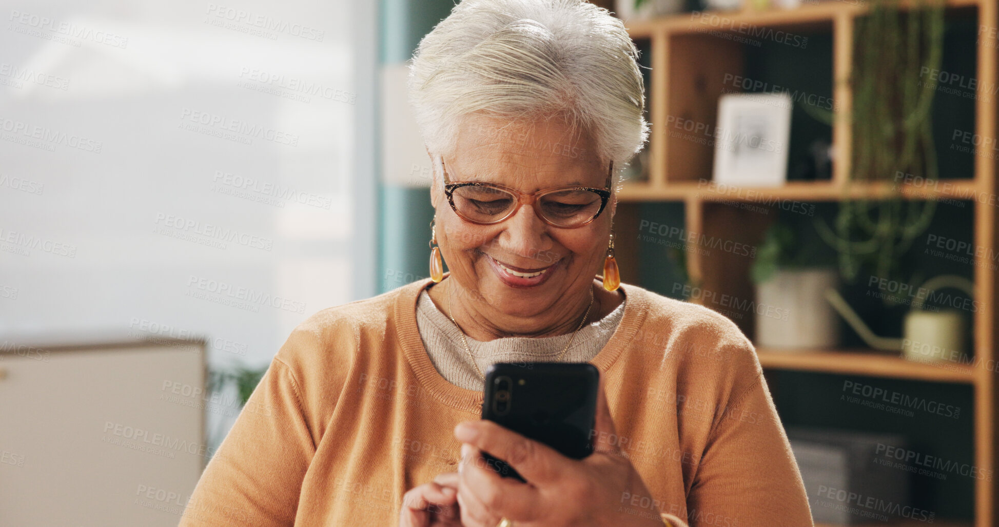Buy stock photo Smile, phone and senior woman in home for email notification, text message or news in retirement. Mobile, elderly person and reading article for online story, newsletter app and browsing website