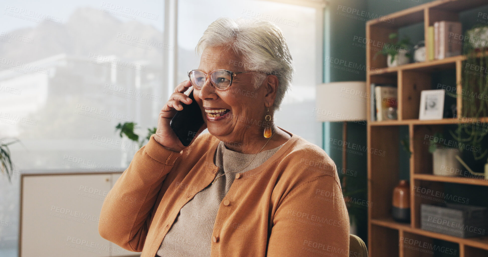 Buy stock photo Laugh, phone call and senior woman in home for communication, news or connection in retirement. Mobile, elderly person and talking to contact for funny story, joke and humor with gossip at apartment