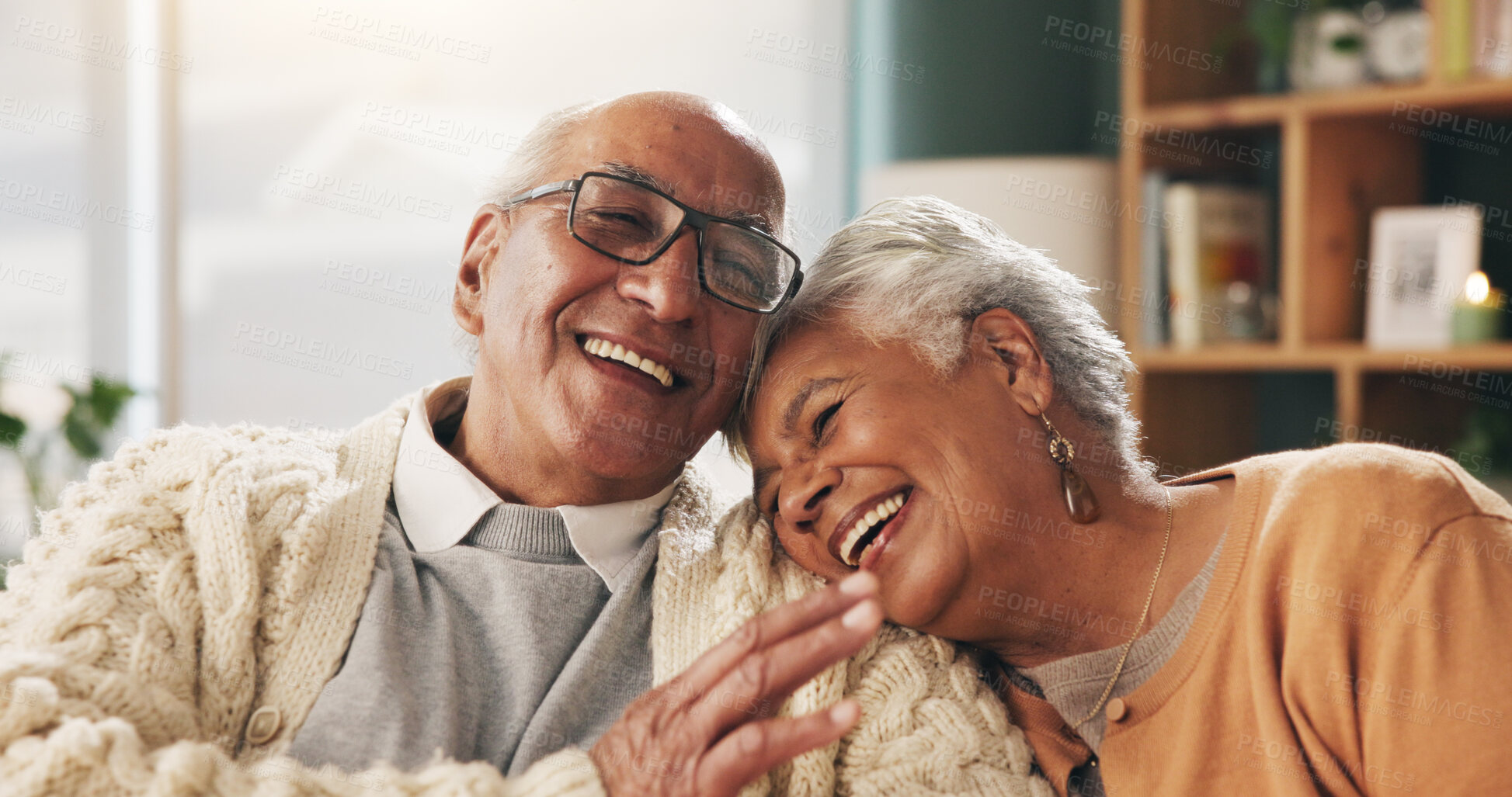 Buy stock photo Old couple and bonding with smile in house, retirement and laughing with partner on weekend or relax. Elderly people, embrace and comfortable with spouse, happy and funny conversation in living room