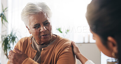 Buy stock photo Support, checkup and nurse with senior woman in retirement home for explaining medical diagnosis. Healthcare, talk and elderly patient with arm pain at consultation with caregiver at nursing facility