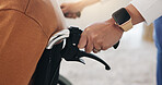 Hands, healthcare and wheelchair with people in clinic together for healing, recovery or support. Assisted living, push and smart watch of nurse with patient in hospital for medical rehabilitation