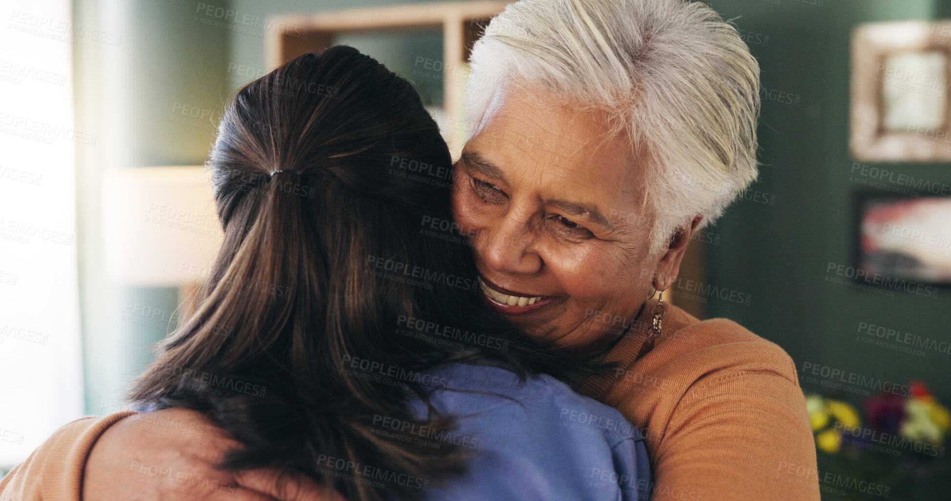 Buy stock photo Healthcare, hug and smile of old woman with nurse in retirement home for assisted living. Medical, support and thank you with senior person embracing caregiver in apartment for rehabilitation