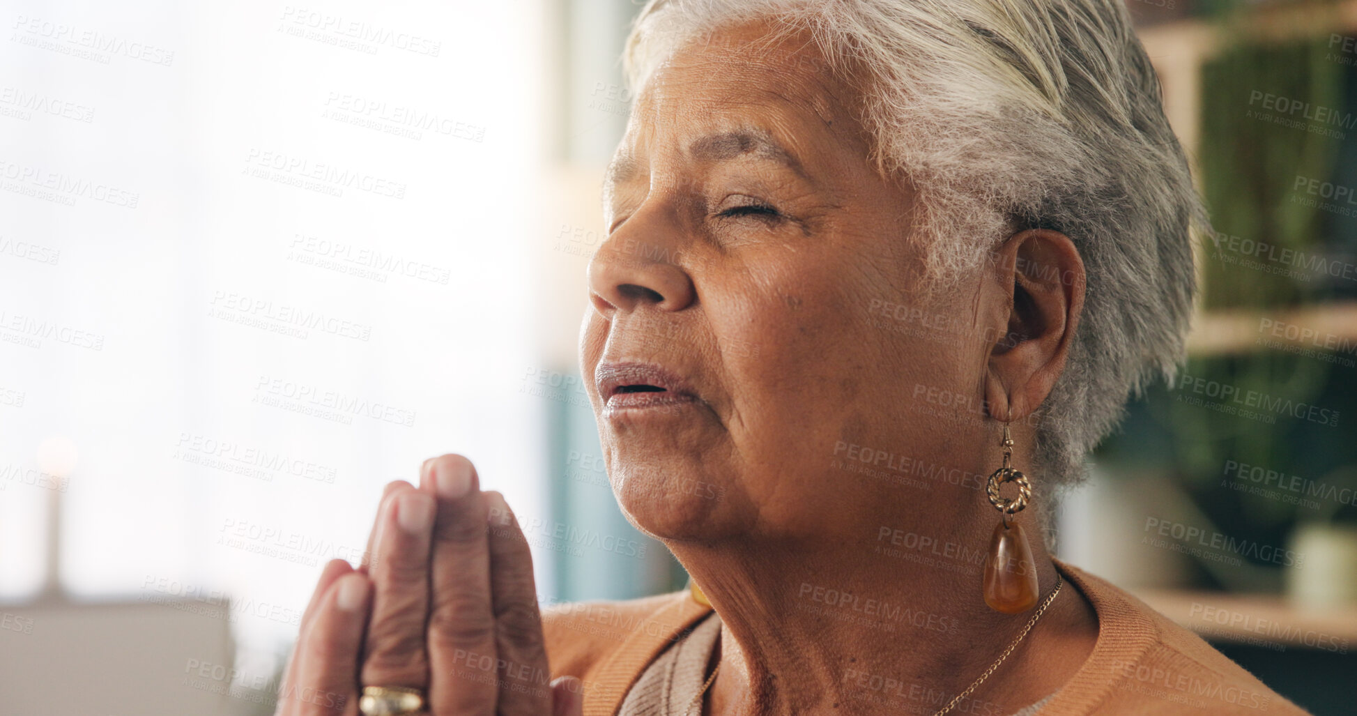 Buy stock photo Faith, prayer and old woman in home for worship, express gratitude or blessings with eyes closed. Elderly person, hands together and praying in retirement with religion, spiritual guidance and belief