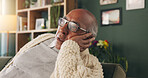 Thinking, stress and senior man on sofa in home with planning retirement funds or savings. Doubt, choice and elderly male person with decision for pension finance in living room at apartment.