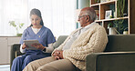 Tablet, caregiver and senior man in home for healthcare update, review results and assisted living. Tech, nurse and elderly patient at house for homecare, medical feedback or report in retirement