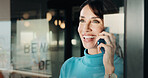 Window, discussion and happy woman with phone call for business conversation or connection. Female person, employee or smile with smartphone or reflection for communication or network in workplace
