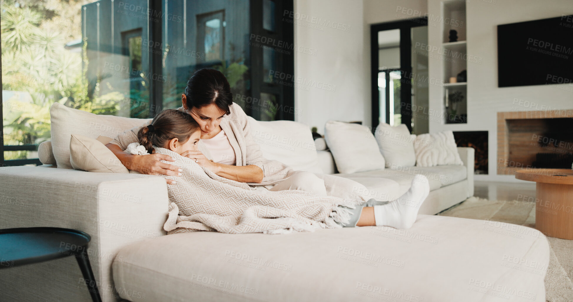 Buy stock photo Mom, home and hug with child on couch, bonding and emotional support for girl and family connection. Woman, love and embrace with daughter in living room, understanding and comfort for kid or trust