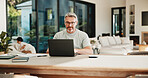 Laptop, typing and man in home with remote work for software development with online project. Mature person, family and male cybersecurity analyst with computer for freelance career in house.