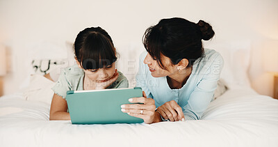 Buy stock photo Mother, daughter and reading in bedroom with tablet, ebook and online literature for knowledge growth. Happy family, mom and child in home with tech, storytelling app and learning for development.