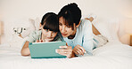 Mother, daughter and bonding in bedroom with tablet, reading ebook and literature for development. Family, mom and child relax in home with tech, storytelling app and learning for knowledge growth.