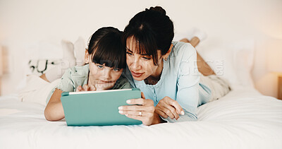 Buy stock photo Mother, daughter and bonding in bedroom with tablet, reading ebook and literature for development. Family, mom and child relax in home with tech, storytelling app and learning for knowledge growth.