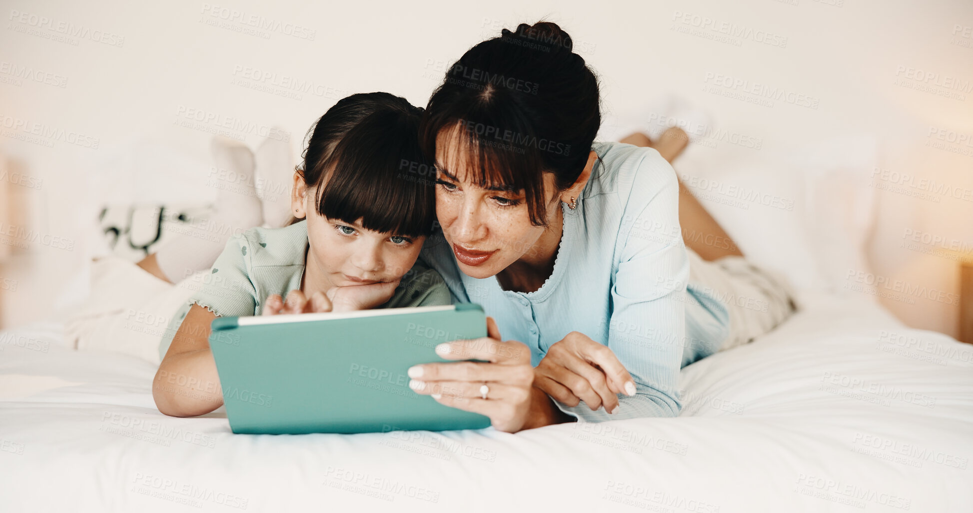 Buy stock photo Mother, daughter and bonding in bedroom with tablet, reading ebook and literature for development. Family, mom and child relax in home with tech, storytelling app and learning for knowledge growth.