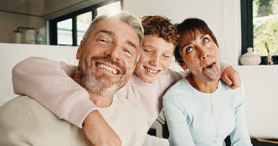Buy stock photo Family, hug and love in home, funny face or connection together on weekend break with child. Mother, father and kid at house for care, portrait and embrace parents for support with silly memory
