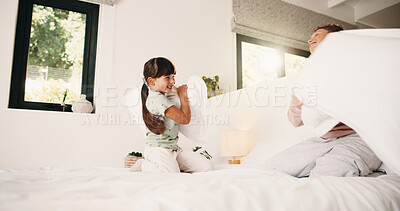 Buy stock photo Smile, children and fight with pillow in bedroom for fun, playful interaction and friendly battle. Happy, siblings and playing with cushion, morning activity and funny games for weekend break in home