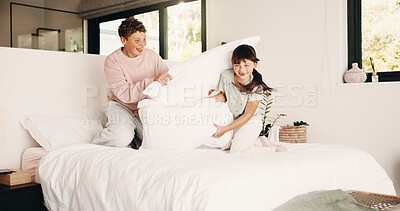 Buy stock photo Smile, siblings and fight with pillow in bedroom for fun, playful interaction and friendly battle. Happy, children and playing with cushion, morning activity and funny games for weekend break in home