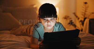 Buy stock photo Child, online and rest with tablet in bedroom, entertainment or girl with internet connection on bed. Streaming, movies and kid with app subscription, serious and watching series at night in house