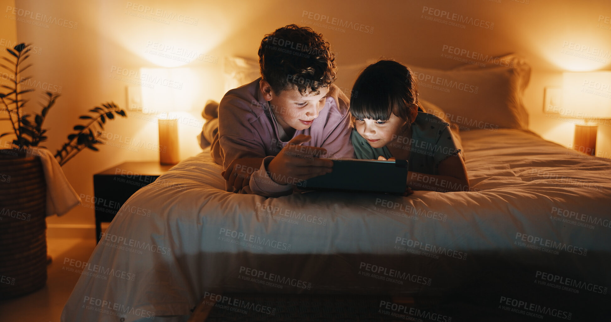 Buy stock photo Night, relax and children with tablet in bedroom for game, streaming cartoon or watch show. Tech, siblings and kids on bed at home for movie, subscription service and entertainment on internet