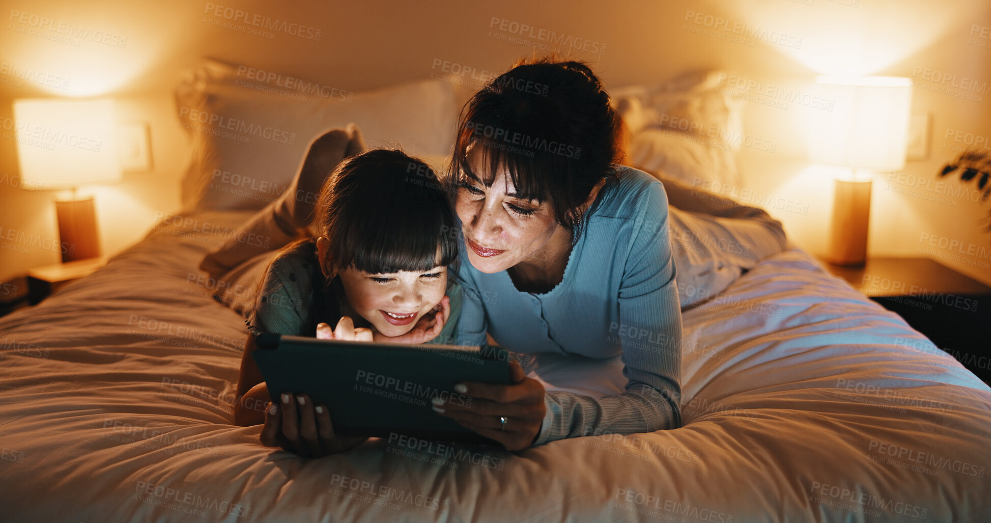 Buy stock photo Love, mother and kid with tablet in bedroom for reading ebook, storytelling or bonding together. Tech, happy girl and mom at home for online fairytale, bedtime story and relax with parent at night