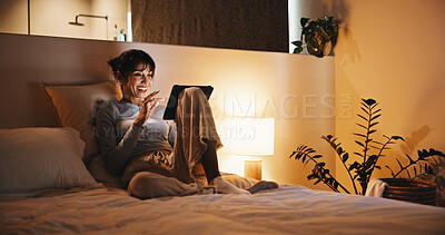 Buy stock photo Laughing, woman and scroll on tablet in bedroom, entertainment and streaming funny movie on website. Happy, mature person and watch comedy series with subscription at night, online and humour in home