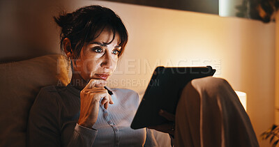 Buy stock photo Serious, woman and relax with tablet in bedroom, entertainment and watching movie on streaming site. Mature person, online and chilling with tech at night, internet and app subscription for film