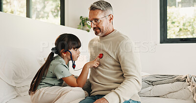 Buy stock photo Child, playing and stethoscope with father at house as pretend doctor, assessment and bonding. Man, daughter and medical tools for fantasy checkup, healthcare role play and imagination for treatment