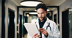 Hospital, tablet and doctor with digital records, schedule or healthcare app for research. Tech, clinic and professional man with telehealth report, review or analysis of online results in hallway