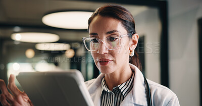 Buy stock photo Healthcare, doctor and woman with tablet in clinic, reading report or update records for insurance. Tech, serious and mature person in hospital for research, medical history and review schedule