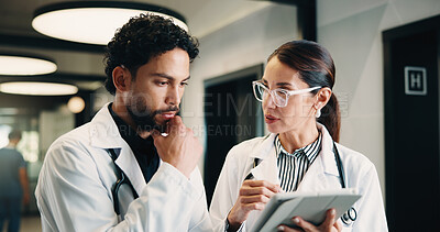 Buy stock photo Healthcare, tablet and team of doctors thinking for problem solving, planning or medical solution. Hospital, tech and people with advice, evaluation or decision for treatment in clinic hallway