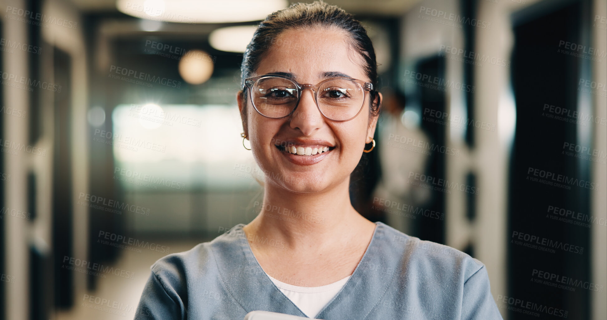 Buy stock photo Portrait, woman and nurse in hospital with smile, knowledge and experience for healthcare service. Happy, female person and medical worker in clinic with glasses, about us and pride for patient care.
