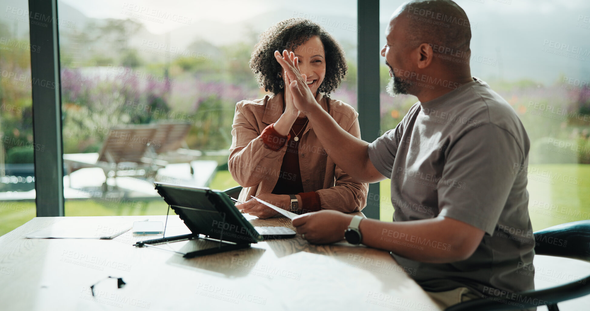 Buy stock photo Documents, high five and couple with tablet in home with planning for budget, savings or investment. Happy, celebration and man with woman for discussion on mortgage application on digital technology