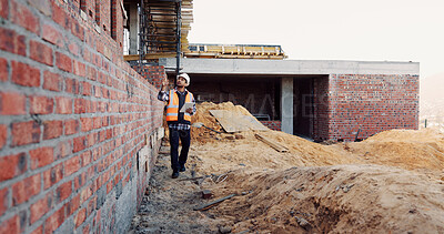 Buy stock photo Civil engineer, inspection and man with tablet at construction site, scroll or project update on web. Outdoor, architect and person with tech for property development, report and quality assurance
