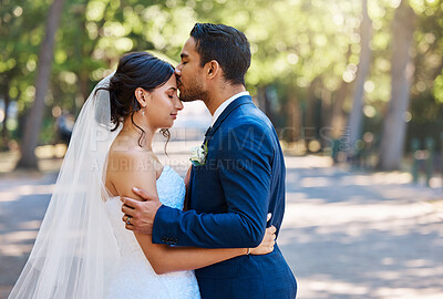 Buy stock photo Wedding, forehead kiss or couple in park with hug, trust or romantic moment in union ceremony. People, bride or groom outdoor with embrace, companion or emotional connection in marriage celebration.