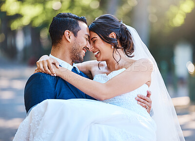 Buy stock photo Carry, happiness and couple at wedding outdoor for marriage, love or trust in nature. Bride, groom and people with affection, partner and support for connection, romantic and forehead touch in park 