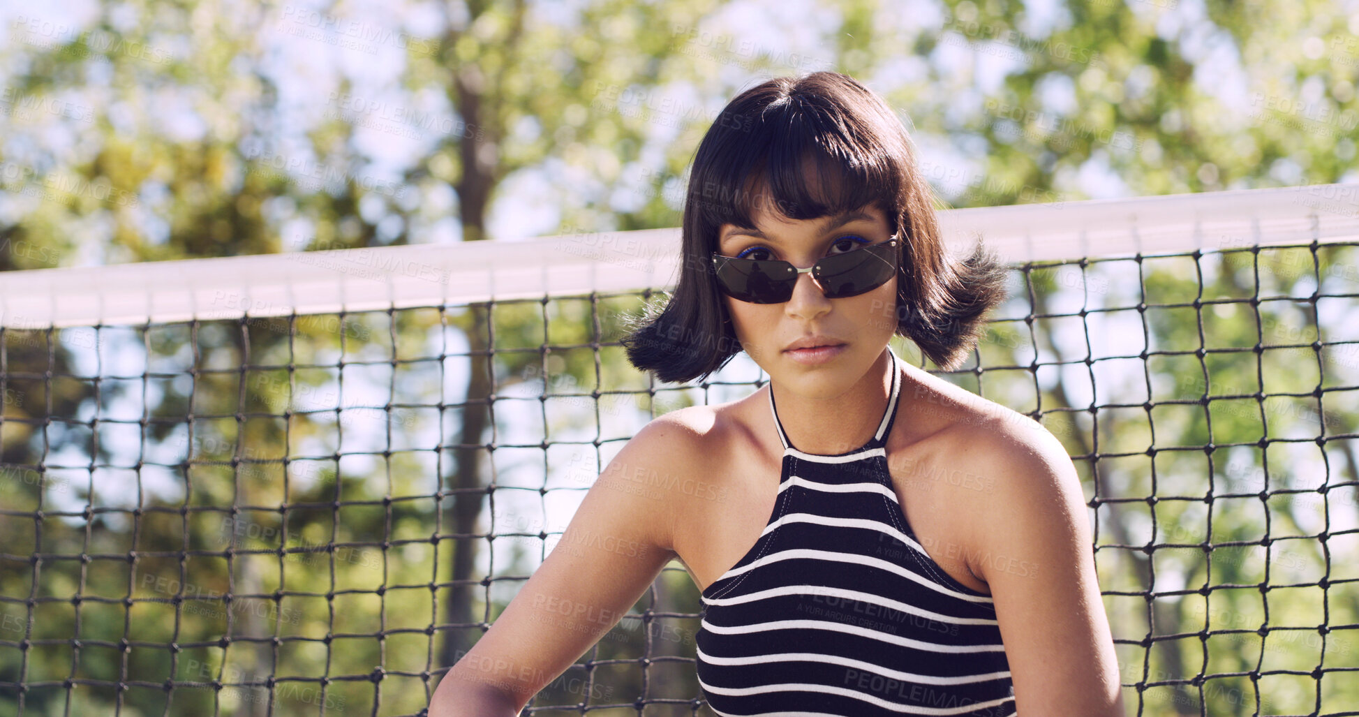 Buy stock photo Portrait, woman and university student on campus court for college, opportunity or confidence. Pride, net and person outdoor for studying with sunglasses, education or sport scholarship or bursary