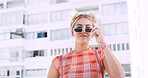 City, student and woman with sunglasses for fashion, travel and serious with scholarship for college. Commuting, portrait and person with university funding, space and confident with stylish shades