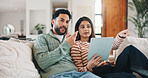Happy couple, bonding and people with tablet in lounge, point and watching movie review with partner. Man, smile and woman with tech for film info, conversation and entertainment on website in house