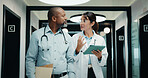 Discussion, walking or doctors with tablet in hospital, care plan assistance or medical case advice. Talk, tech or mature people with specialist referral for treatment, patient diagnosis or teamwork
