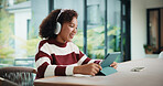 Tablet, elearning and child with headphones on video call in home for online class with education. Talking, digital technology and girl student with audio tech for virtual lesson in apartment.