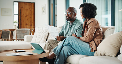 Buy stock photo Document, home and couple with financial planning, insurance update or tax review with tablet. African man, mature woman and savings discussion for investment, paperwork or asset management on sofa