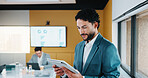Business, man and reading with tablet in meeting for research, finance charts and profit growth. Person, data analyst and digital with graph analysis, investment portfolio and audit review of company