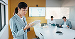 Business, woman and reading with tablet in meeting for research, finance charts or profit growth. Person, data analyst or digital with graph analysis, investment portfolio and audit review of company