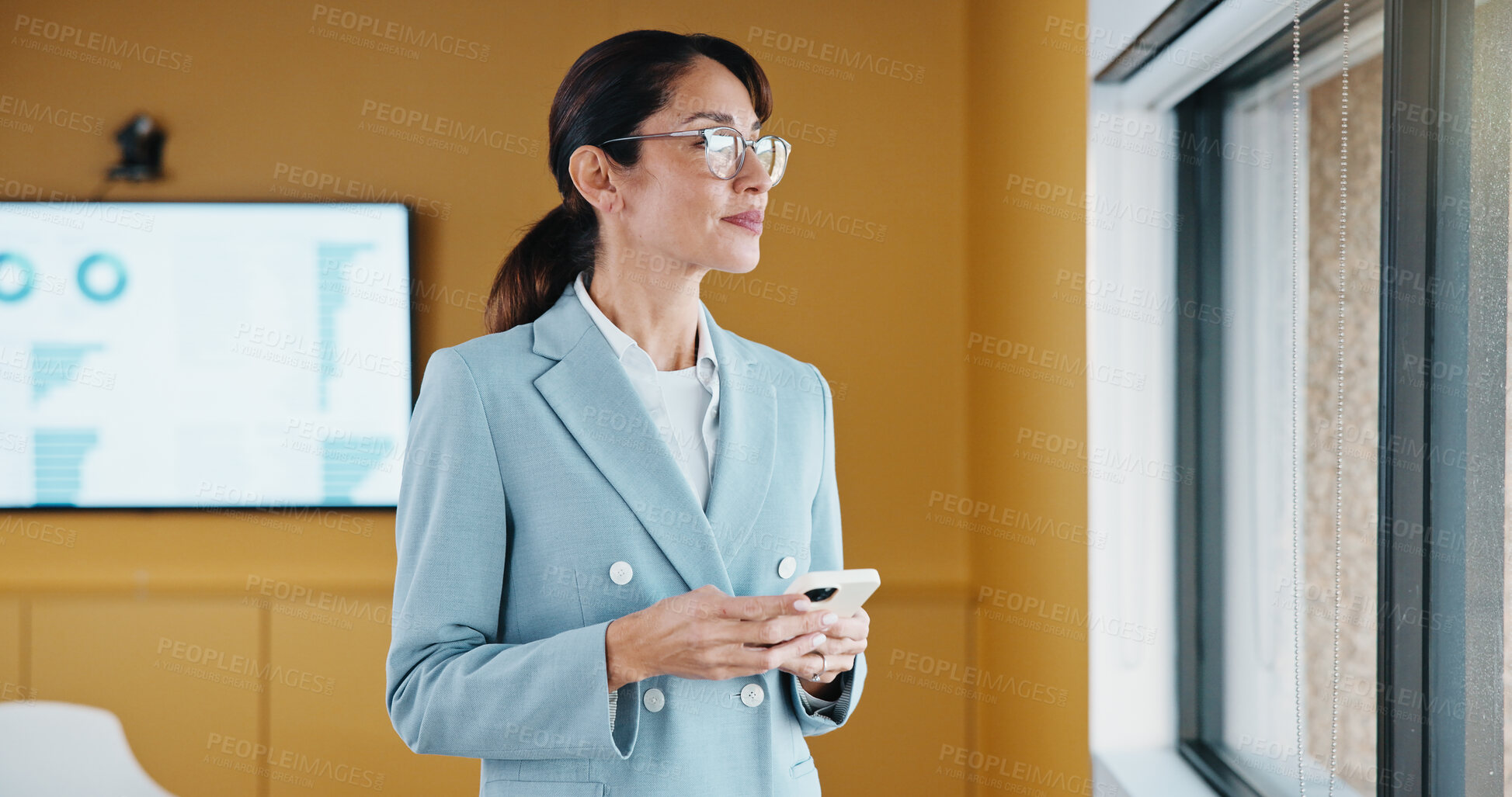 Buy stock photo Thinking, phone and business woman in office for financial insight, data or idea for message. Mobile, analyst and mature person with reflection for investment planning, problem solving or window view