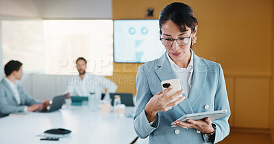 Buy stock photo Business, woman or tablet with phone in meeting for market trends, earnings report or compare data. Financial analyst, mature person and reading tech in office for KPI metrics, finance news or review