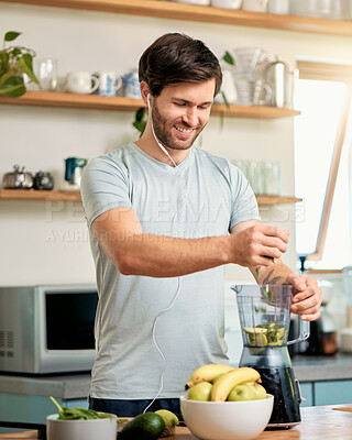 Buy stock photo Earphones, man and happy with fruit in blender for breakfast shake, healthy diet and gut health. Music, person or meal prep with fresh ingredients in home for detox smoothie, nutrition or weight loss