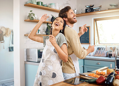Buy stock photo Cooking, happy couple or sing with dancing in kitchen for support, anniversary lunch or bonding. Food, interracial people or laugh with rhythm in home for fun meal prep, music or healthy relationship