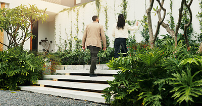 Buy stock photo Back, estate agent and tour with client walking for home investment or property view. Finance, mortgage and rental apartment with man speaking to realtor woman outdoor for advice, consulting or sale