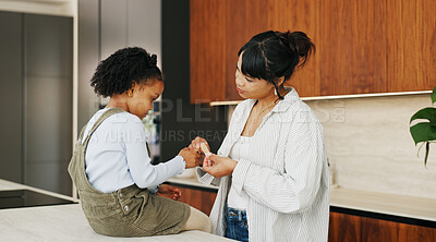 Buy stock photo Plaster, hurt and mother with kid in kitchen for accident, pain or injury with first aid in home. Bandage, family and mom helping girl child with hand sore or wound on counter for care in house.
