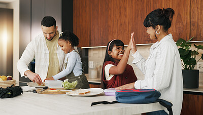 Buy stock photo Mother, child and high five in family home, smile and packing lunch for school preparation. Parents, success and well done with kids in kitchen for motivation, encouragement and support in morning